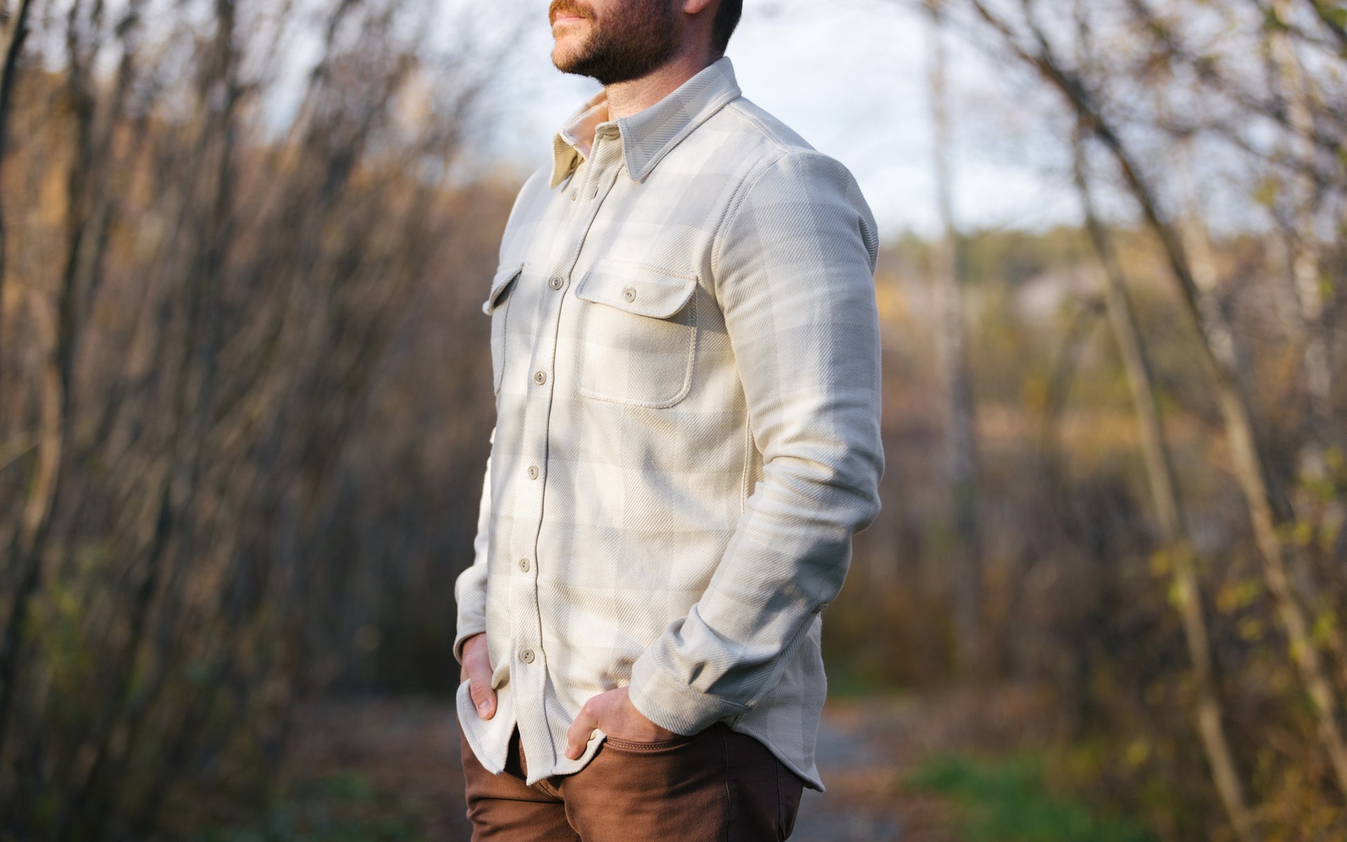 Man wearing a tan plaid Six Season flannel shirt by Warren.