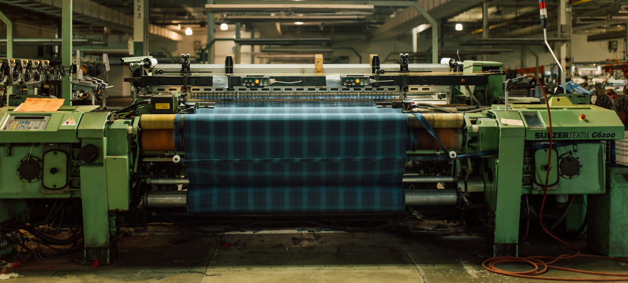 A weaving machine in a textile mill.