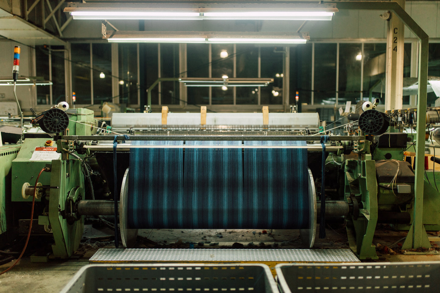 A weaving machine inside a textile mill.